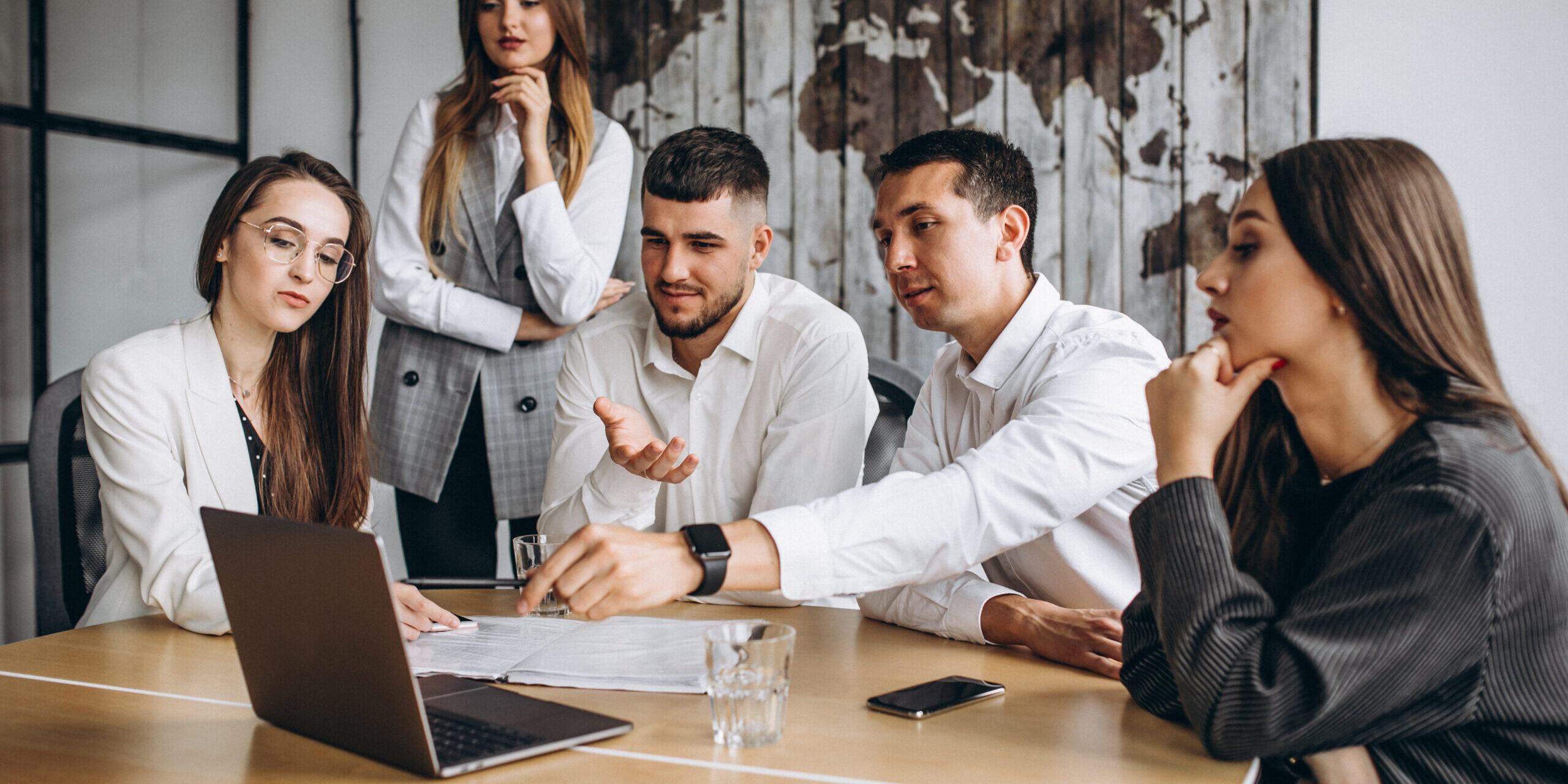 Group of people working out business plan in an office